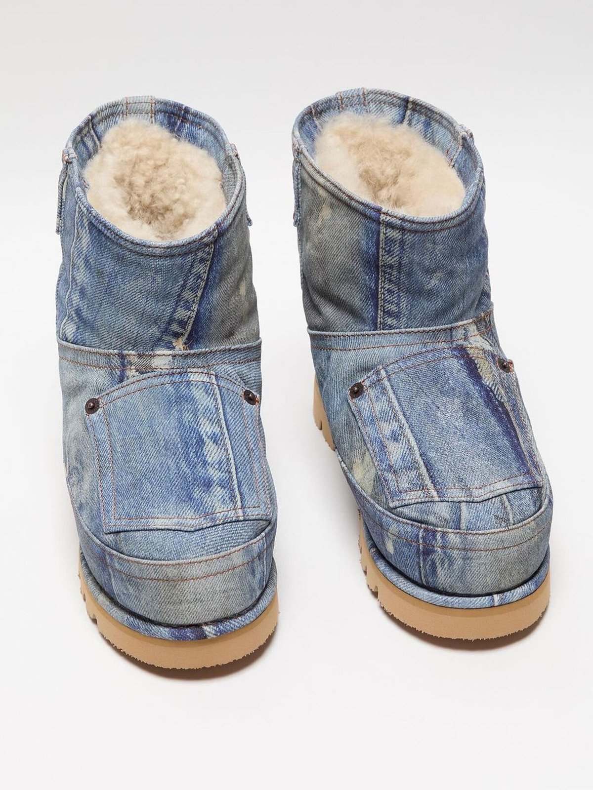 The denim-effect leather of ACNE STUDIOS' boots.